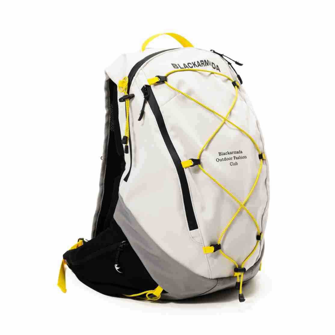 Off-white and gray backpack with yellow crisscross bungee cord, black zip pocket and yellow top handle, three-quarter view