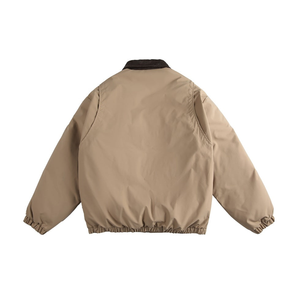 Back view of a tan zip-up jacket with a dark collar and gathered cuffs and hem.