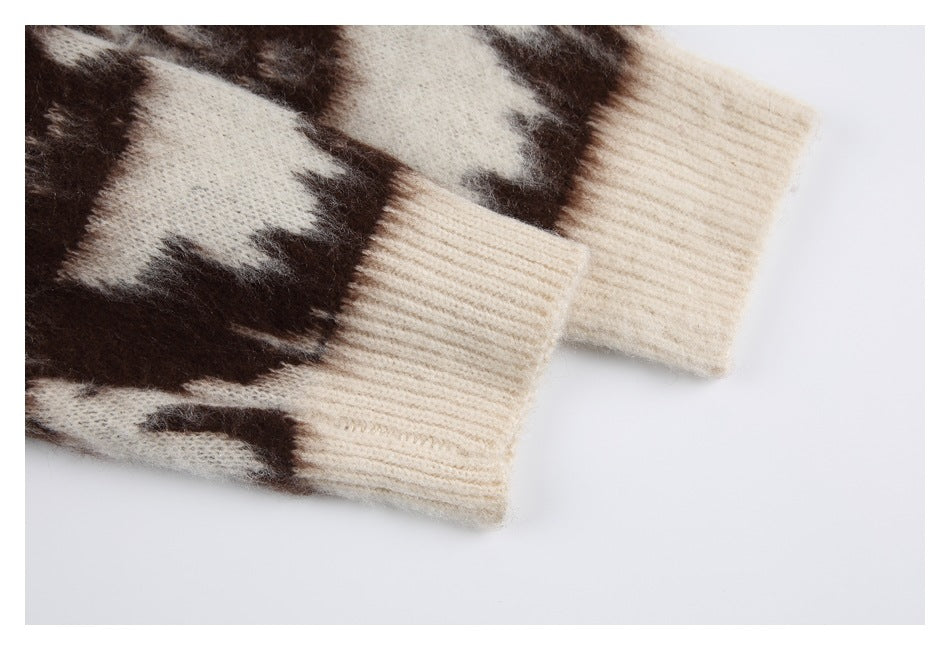 Two cream ribbed sleeve cuffs shown beside the brown-and-cream patterned knit.