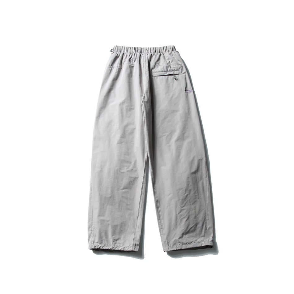 Light gray wide-leg pants laid flat, with an elastic waist and a small zip pocket at the back.