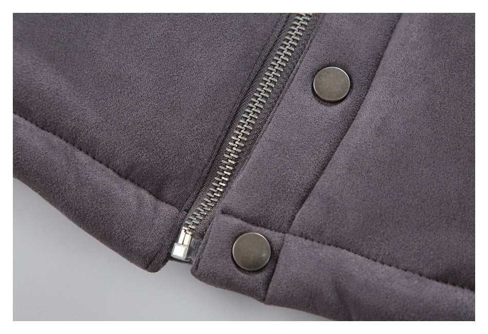 Close-up of the jacket's metal zipper and round snap fasteners on charcoal gray fabric.