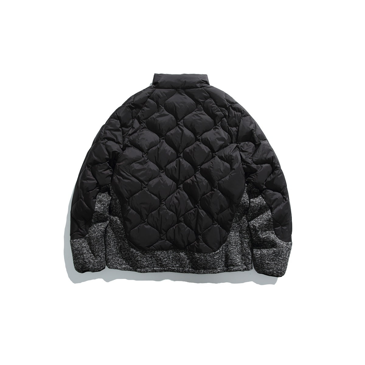 Black quilted jacket back view with diamond quilting and marled charcoal knit-look side and hem panels