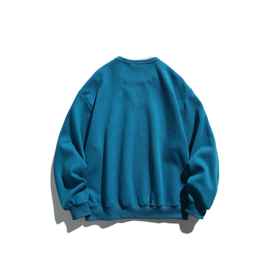 Back view of a plain teal sweatshirt with long sleeves and ribbed cuffs and hem.