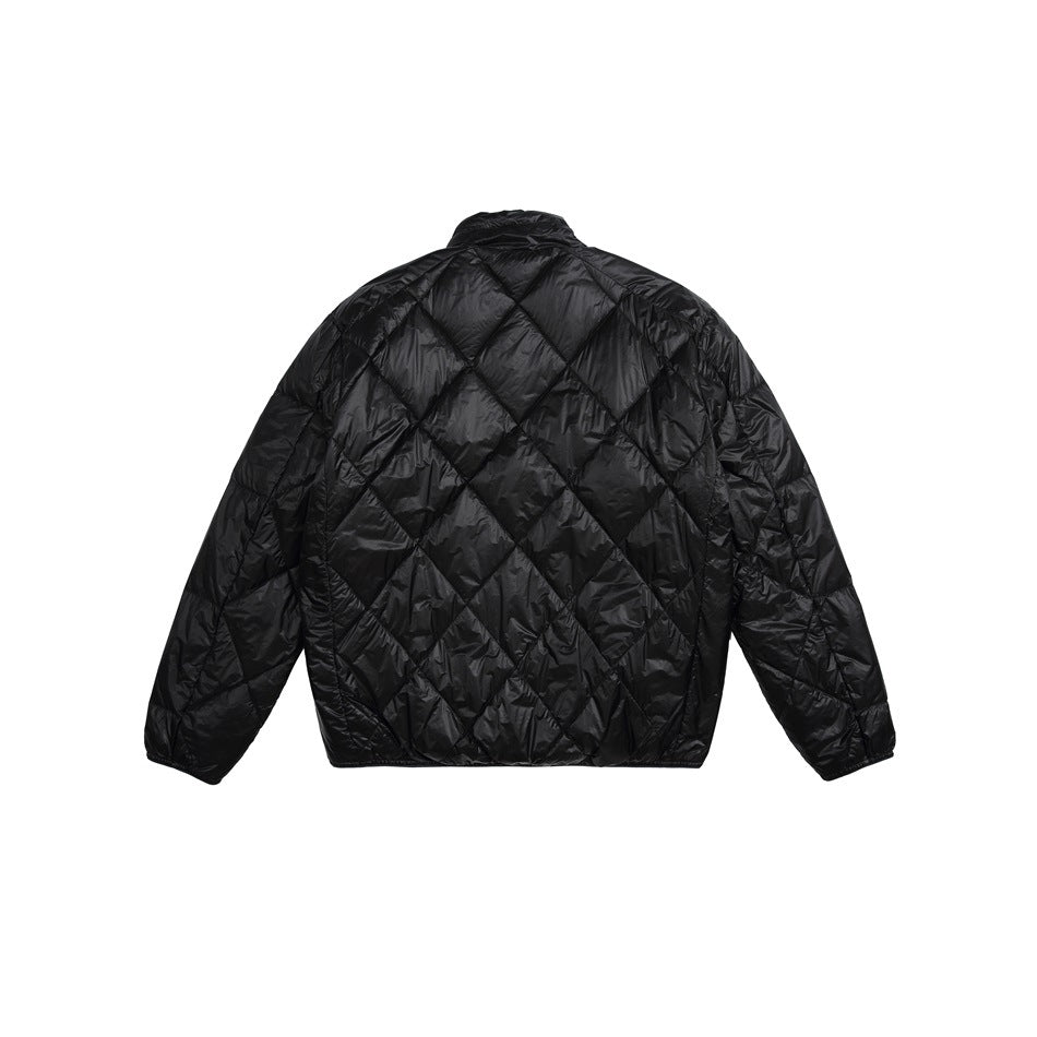 Back view of a black quilted jacket with diamond stitching, long sleeves and a short stand collar.