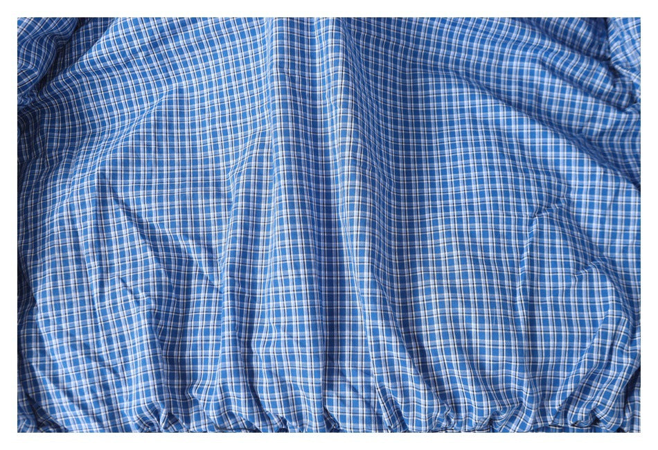 Close-up of the jacket's blue, white, and dark plaid lining.