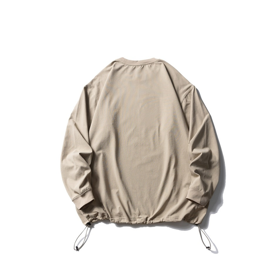 Back view of a light beige long-sleeve crewneck pullover with ribbed cuffs and adjustable drawcords at the hem.