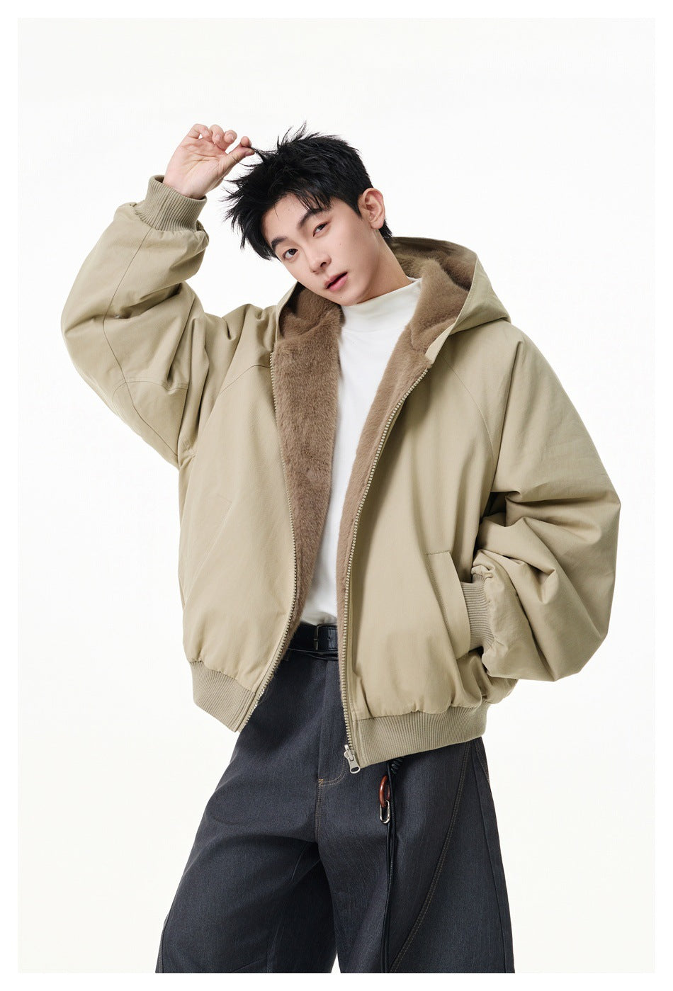 Model wearing an open beige hooded jacket with plush taupe lining, front pockets, and ribbed cuffs and hem.