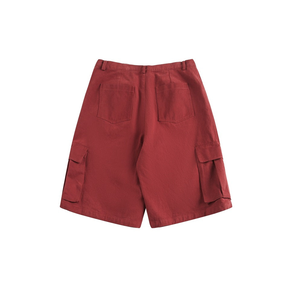 Red knee-length cargo shorts, back flat lay with two patch back pockets and side flap pockets