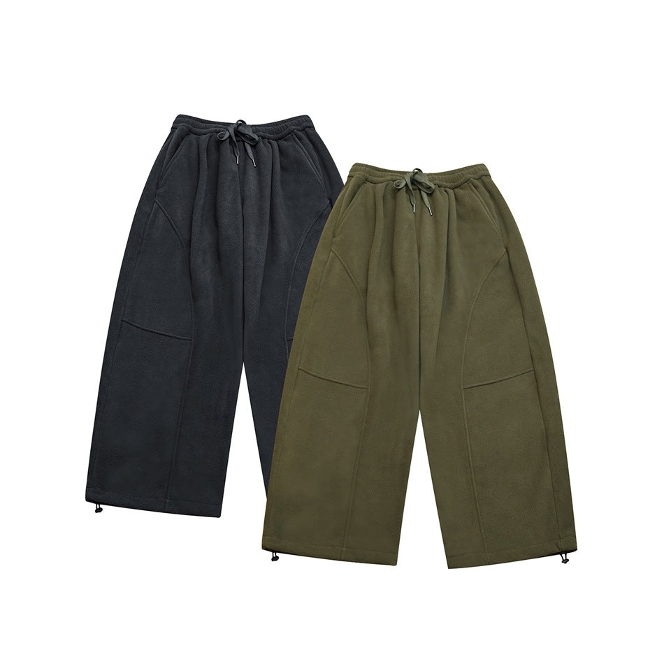 Two pairs of wide-leg drawstring fleece pants shown together in charcoal and olive green.