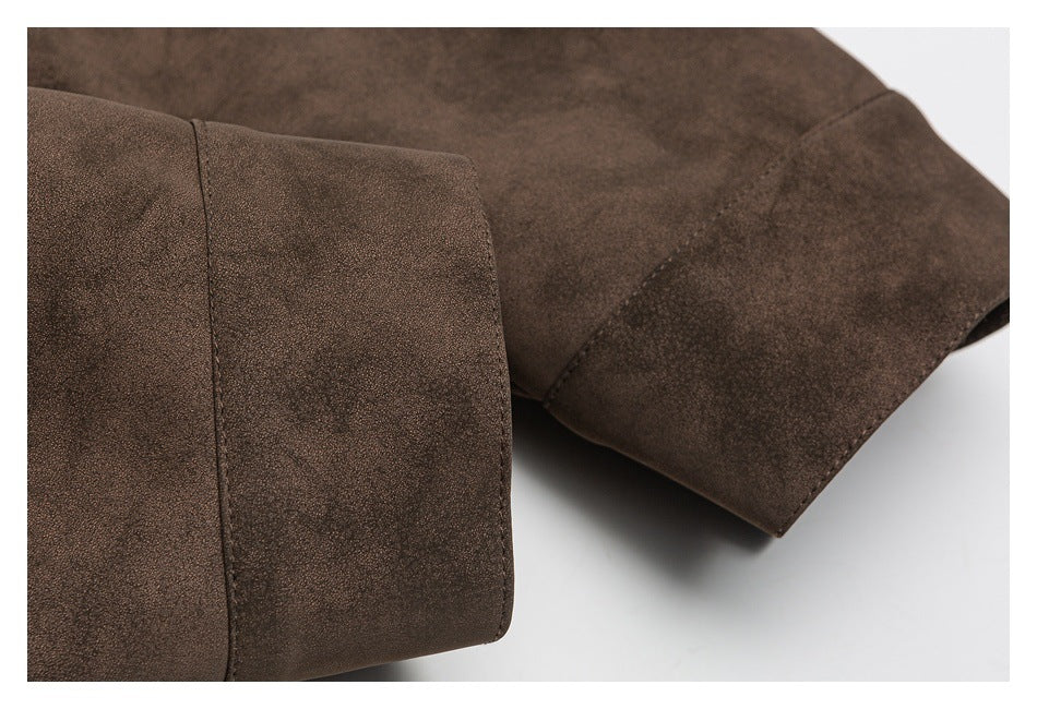 Close-up of a dark brown sleeve cuff and stitched seam.