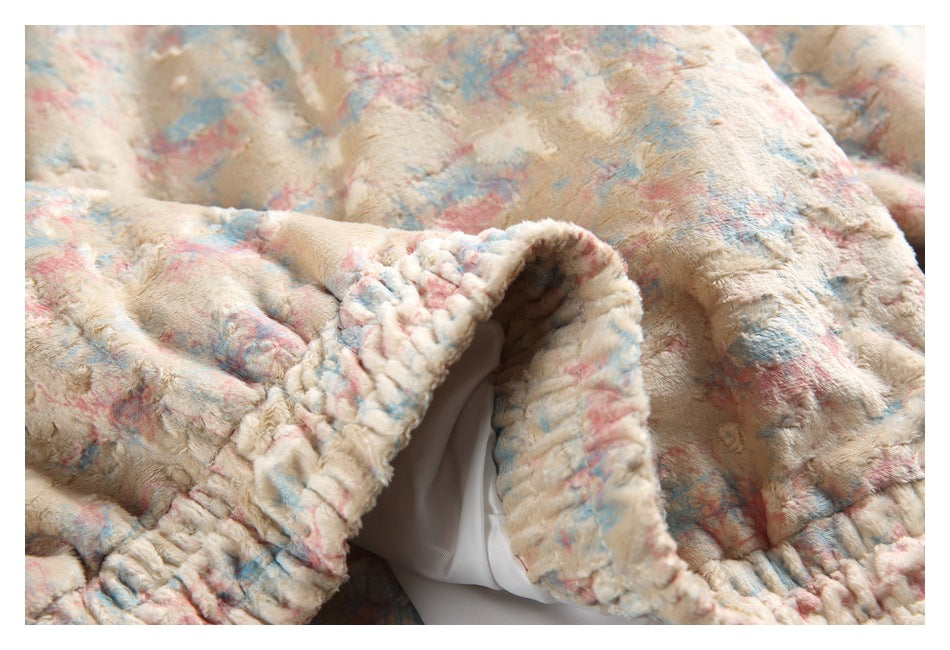 Close-up of a folded opening in the patterned plush jacket, showing its white lining.