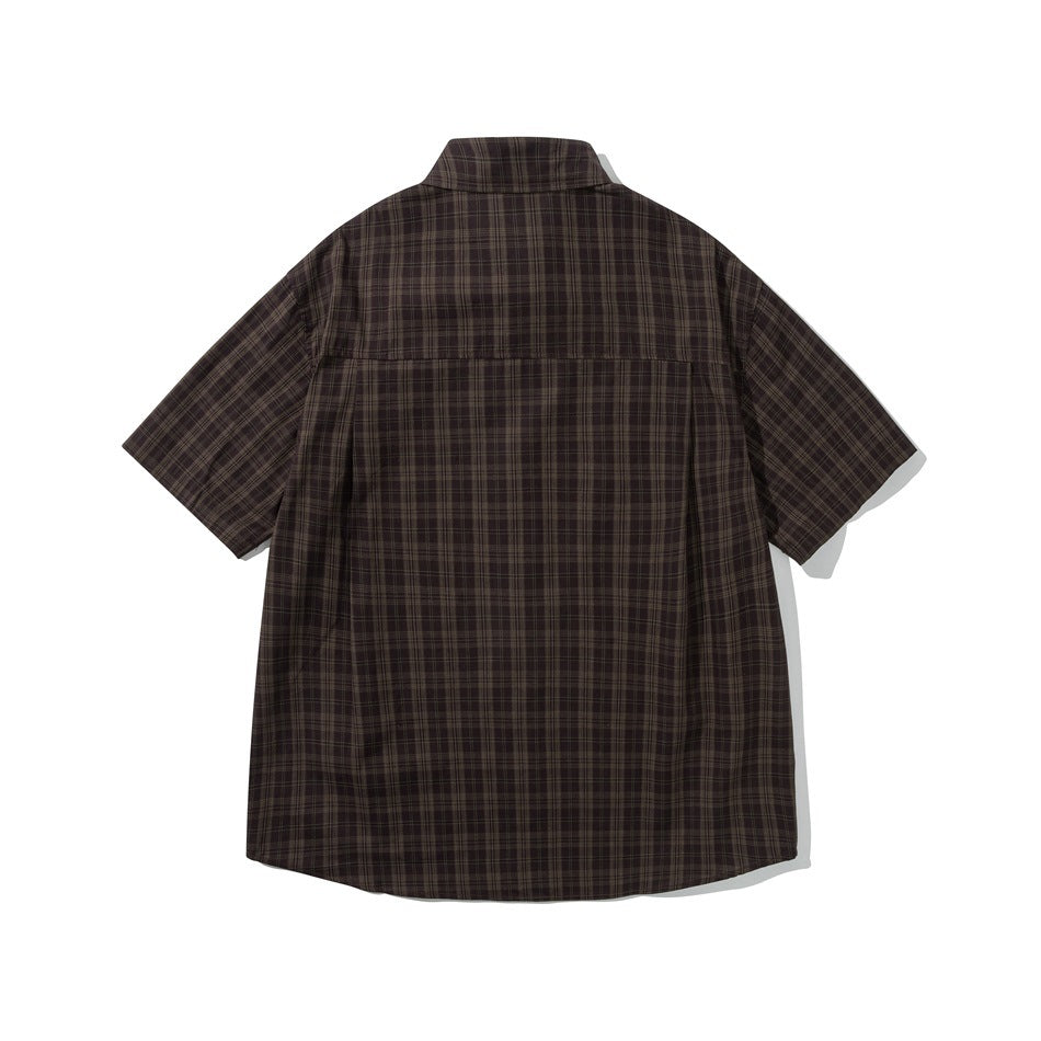 Back view of brown plaid short-sleeve shirt showing back yoke and center pleat, flat lay