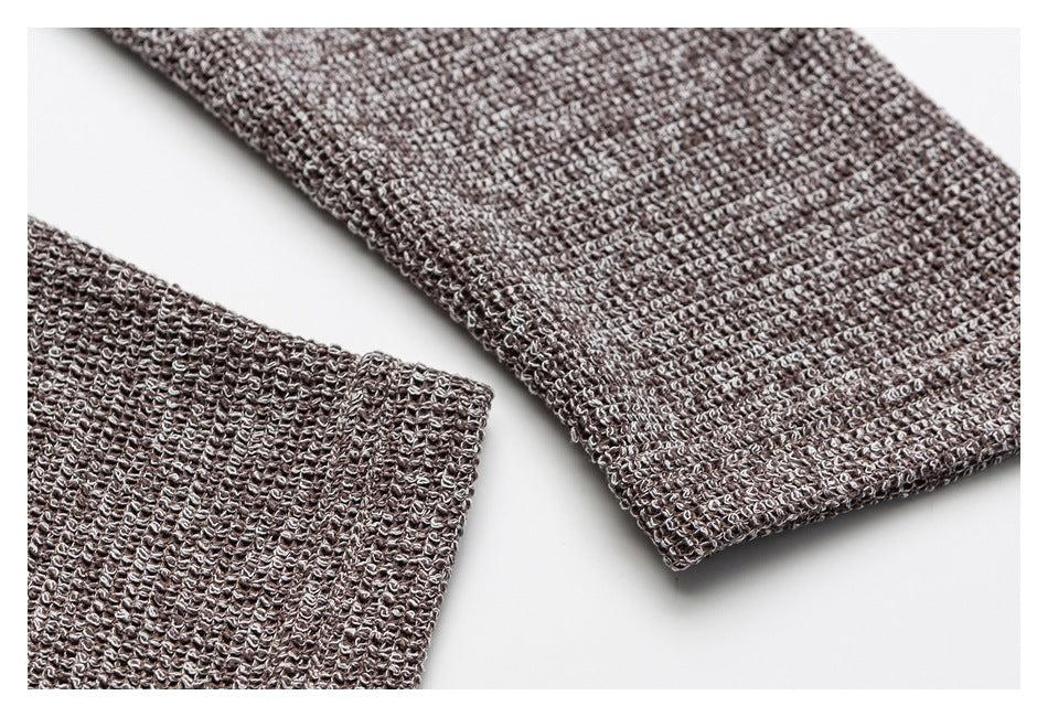 Close-up of the marled knit cardigan sleeves and ribbed cuffs.