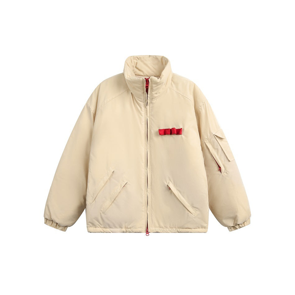Beige quilted puffer jacket with stand collar, red zipper and chest bow trim, flat front view