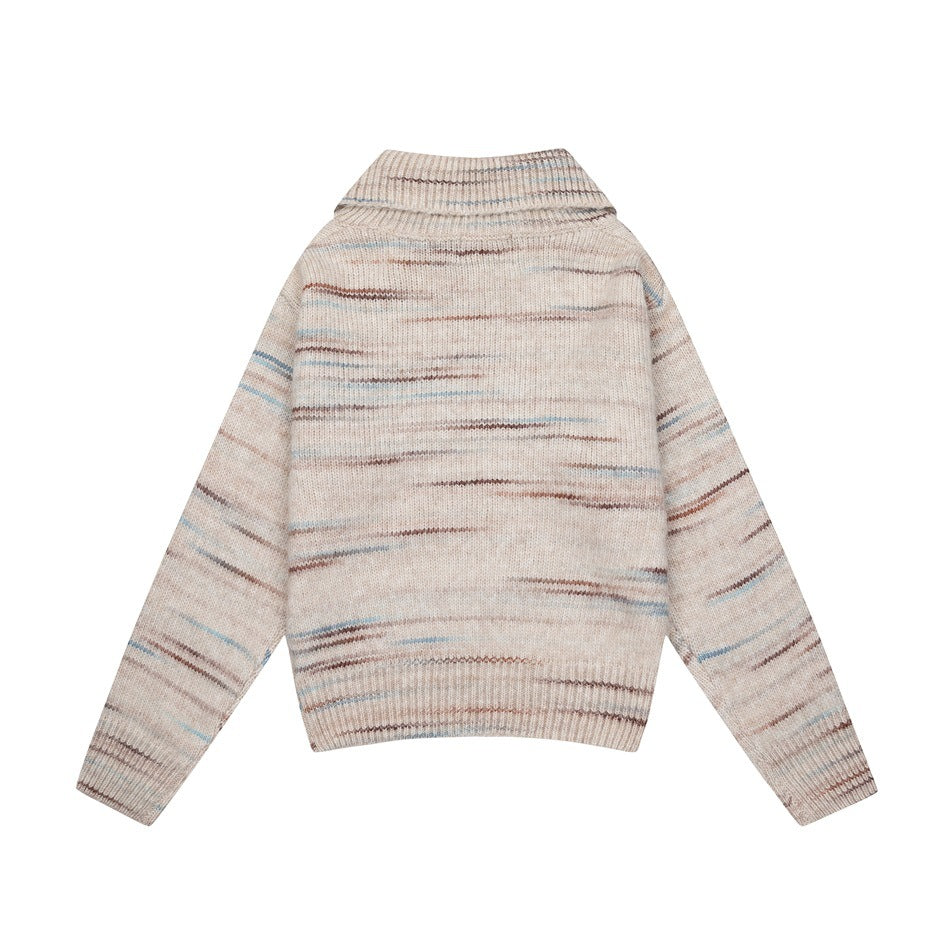 Back view of a beige knit sweater with a folded collar, long sleeves, ribbed hems, and muted multicolor horizontal streaks.