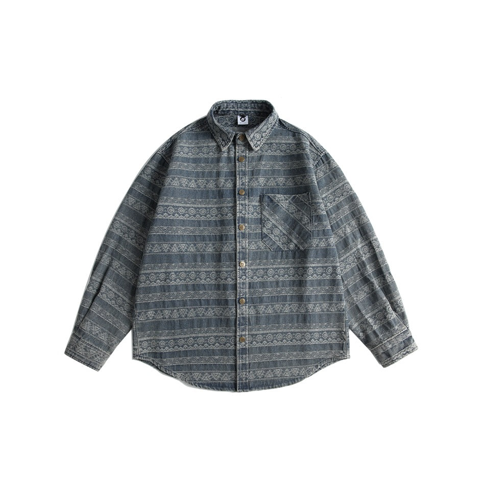 Denim-blue long-sleeve button-up shirt with tribal jacquard stripes, chest pocket and curved hem, flat lay front view