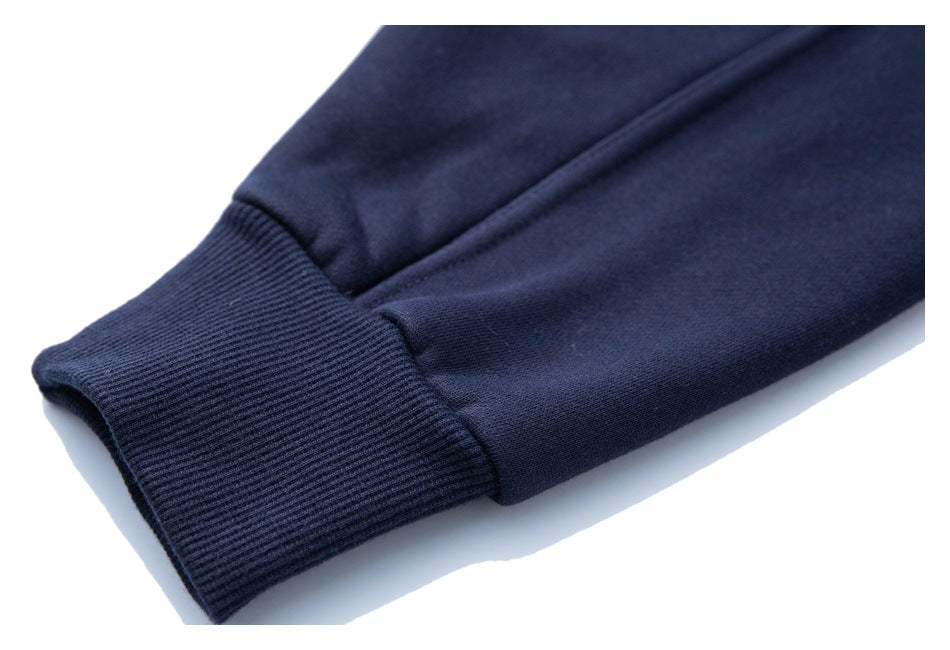 Close-up of a navy sleeve with a ribbed cuff and seam.