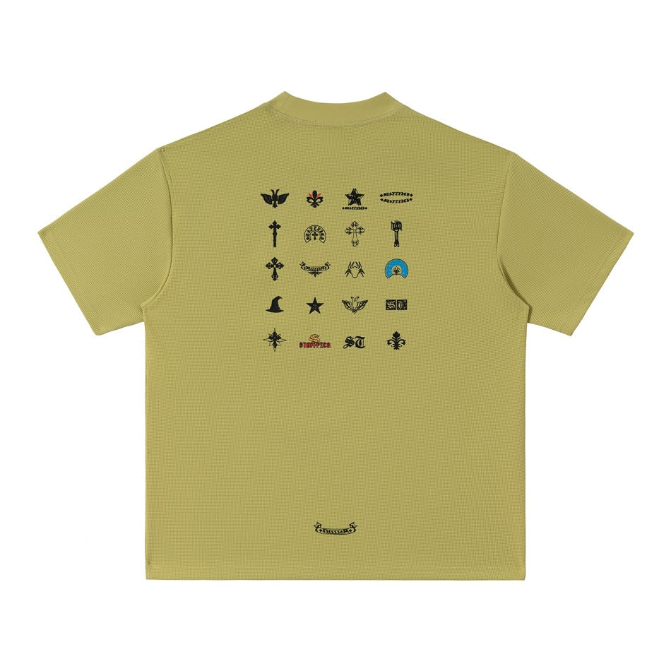 Green waffle-textured short-sleeve T-shirt, back view with grid of black emblem prints