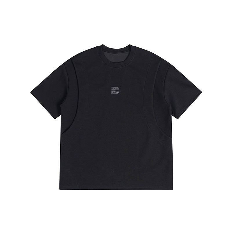 Black short-sleeve crew-neck T-shirt with curved seam panels and a small B logo patch at center chest, flat lay