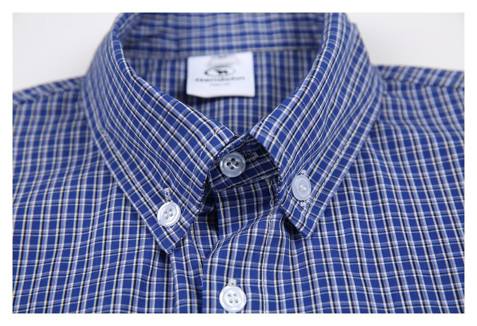 Close-up of the blue checked shirt's button-down collar and buttons.