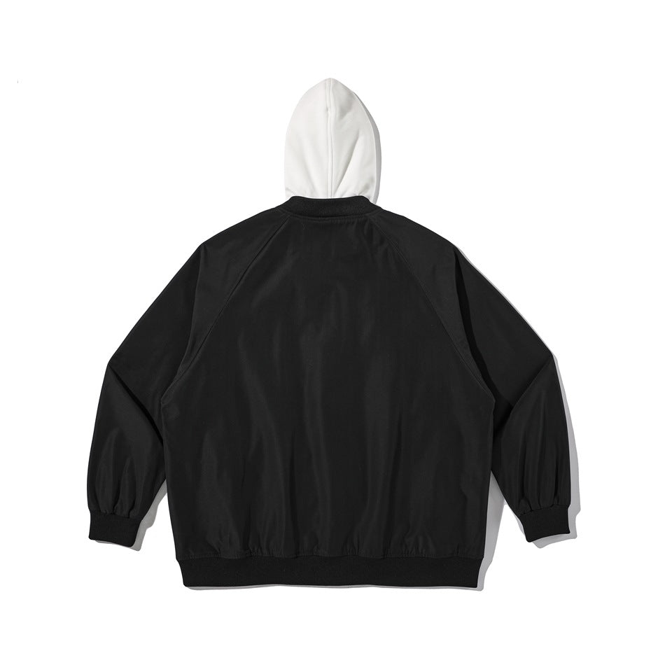 Back view of a black jacket with a white hood, raglan sleeves, and black ribbed cuffs and hem.