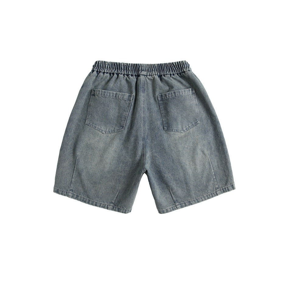 Back view of faded blue denim-look shorts with elastic waistband and two patch pockets, flat lay