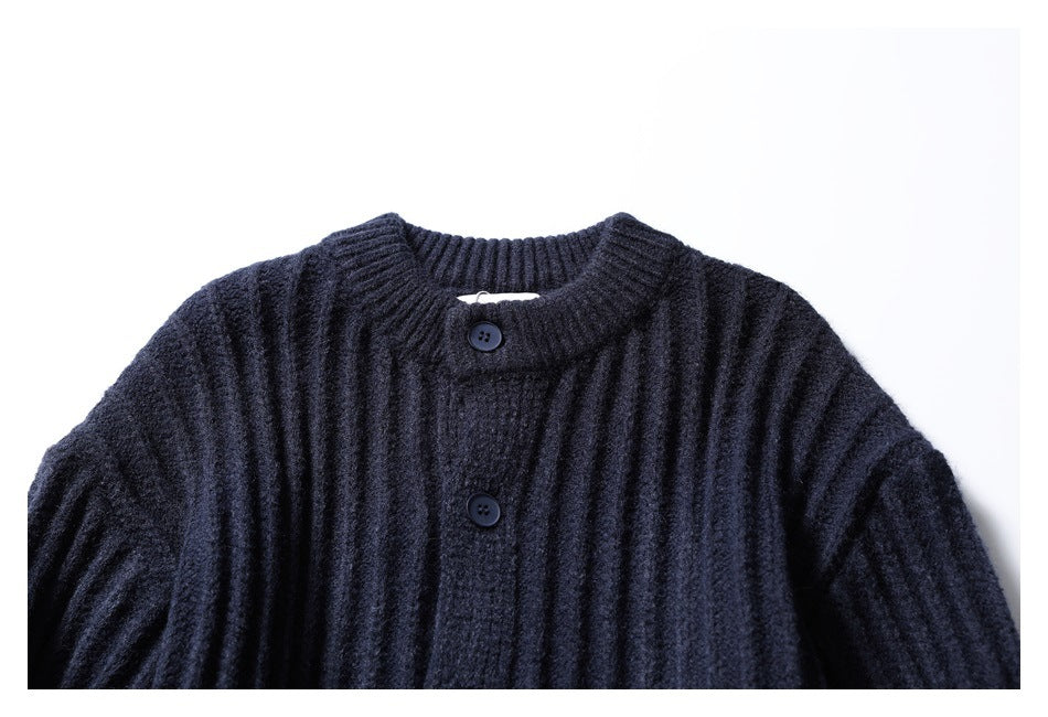 Close-up of the dark navy cardigan's ribbed stand collar and top buttons.