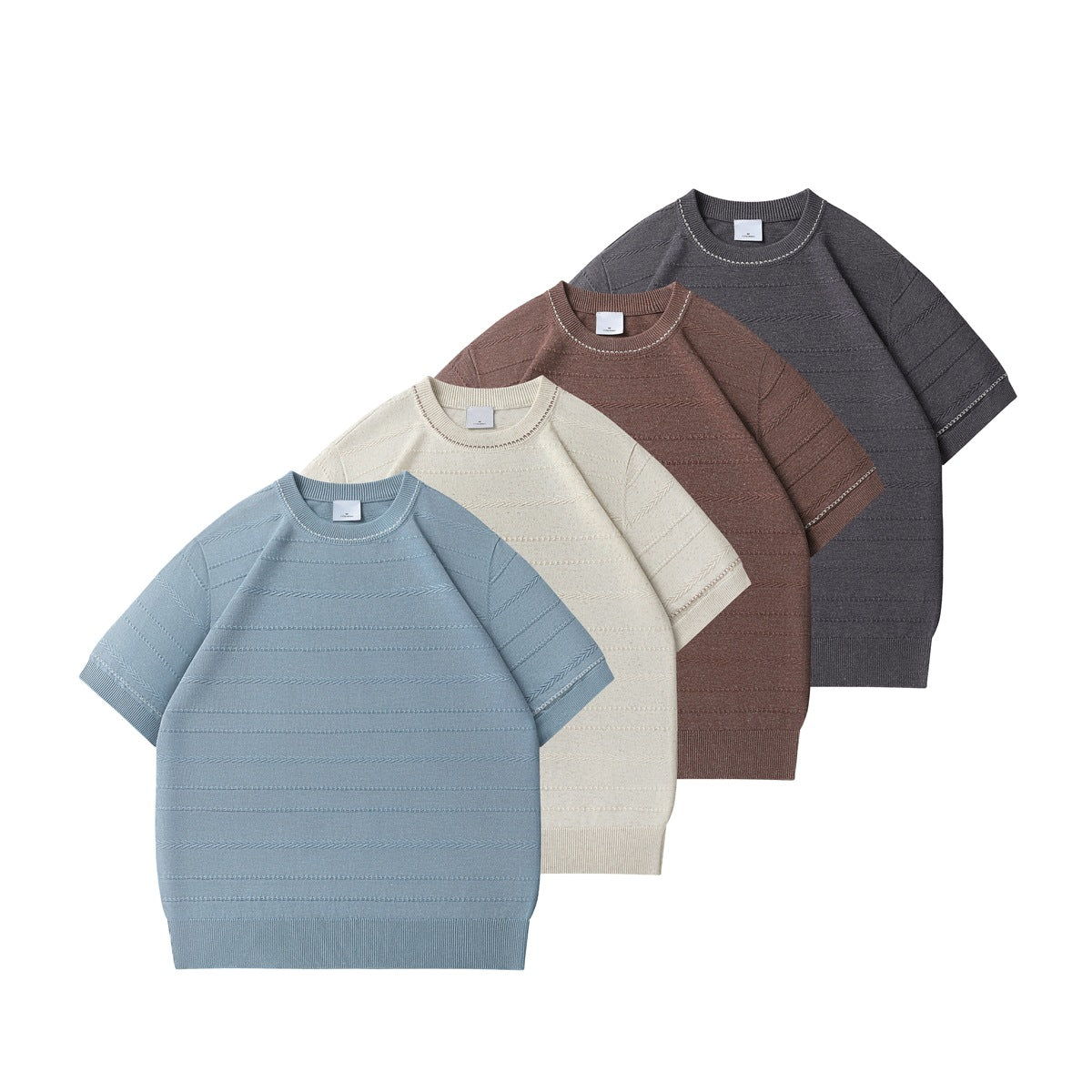 Four short-sleeve crew-neck knit tops arranged together in blue, cream, brown, and charcoal.