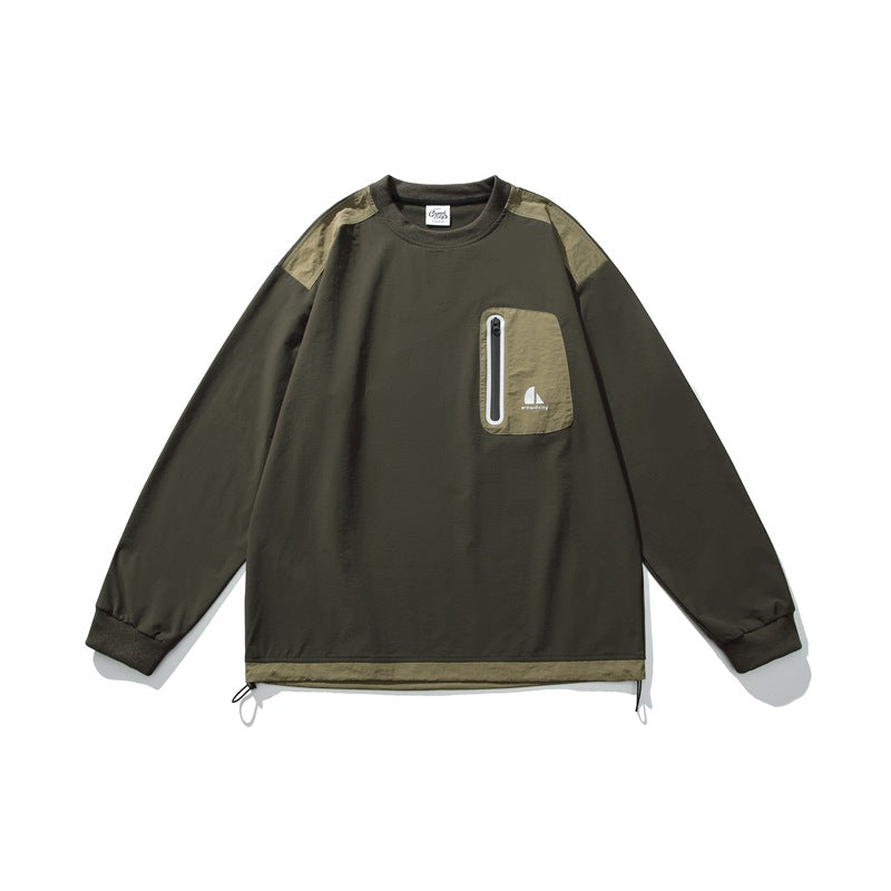 Army green crewneck pullover with khaki shoulder panels, zip chest pocket, ribbed cuffs and drawcord hem, flat lay front