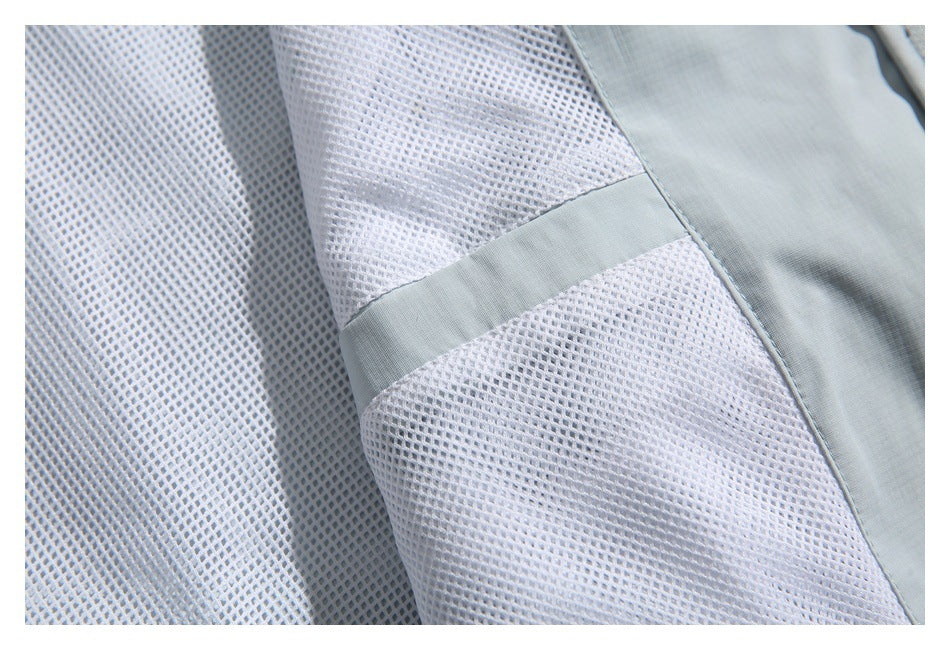 Close-up of white mesh panels beside pale blue-gray fabric and a matching trim strip.