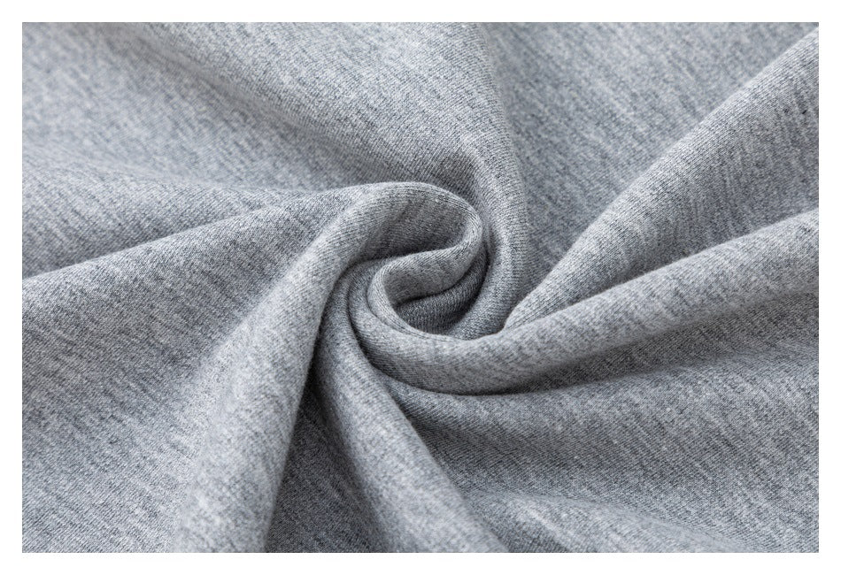 Close-up of heather gray knit fabric gathered into soft folds.