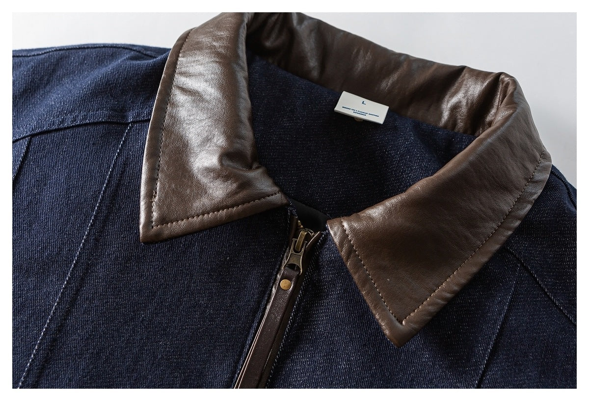 Close-up of the jacket's brown collar, dark indigo body, and front zipper.