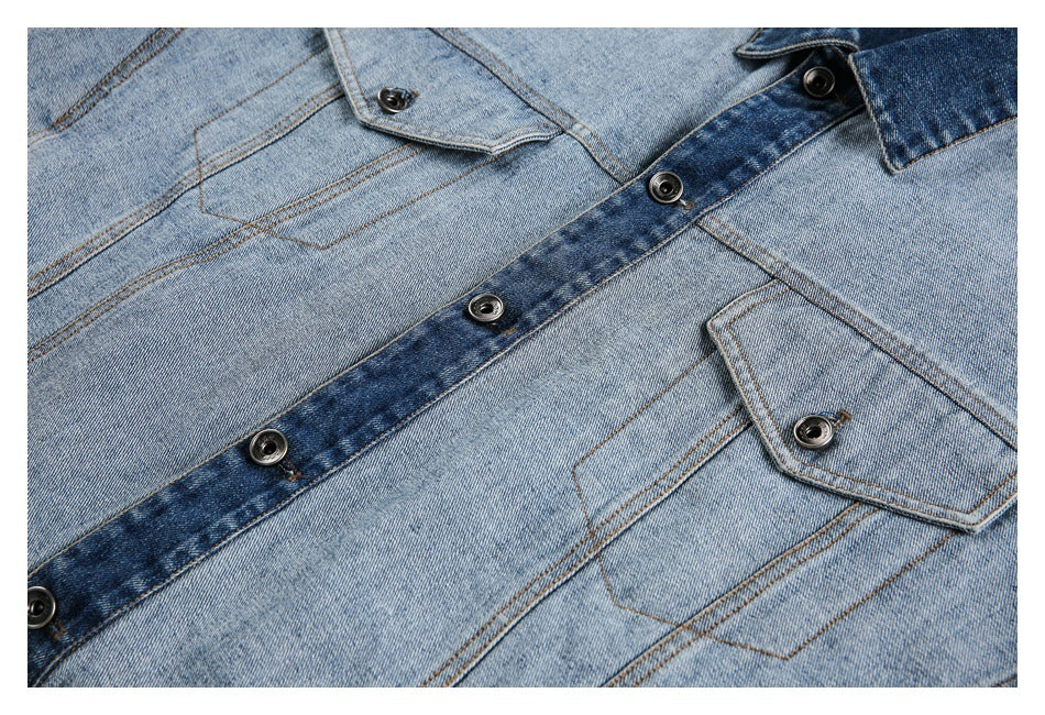 Close-up of the denim jacket's button placket and two flap chest pockets.