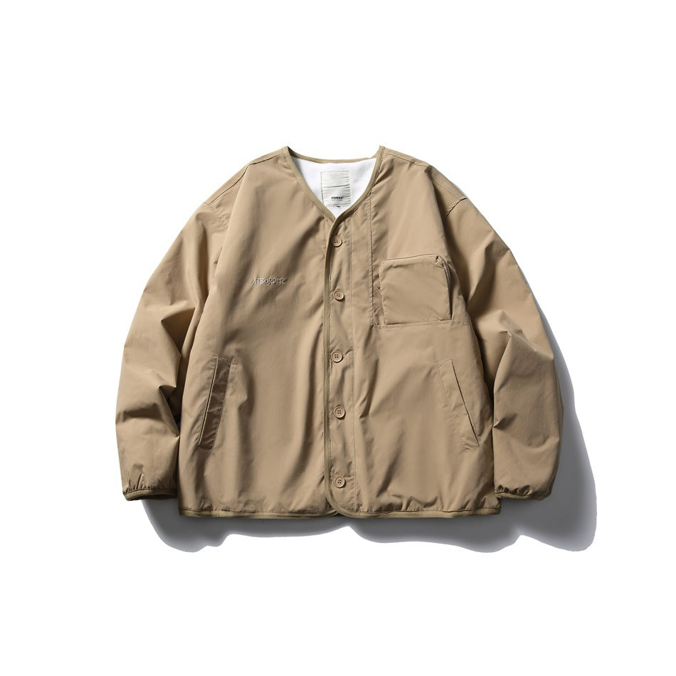 Khaki collarless button-front jacket flat lay with zip chest pocket, side pockets and elastic cuffs