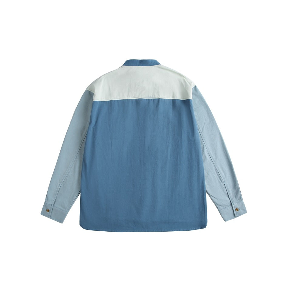 Back view of a blue shirt with pale blue sleeves and a pale yoke panel across the shoulders.