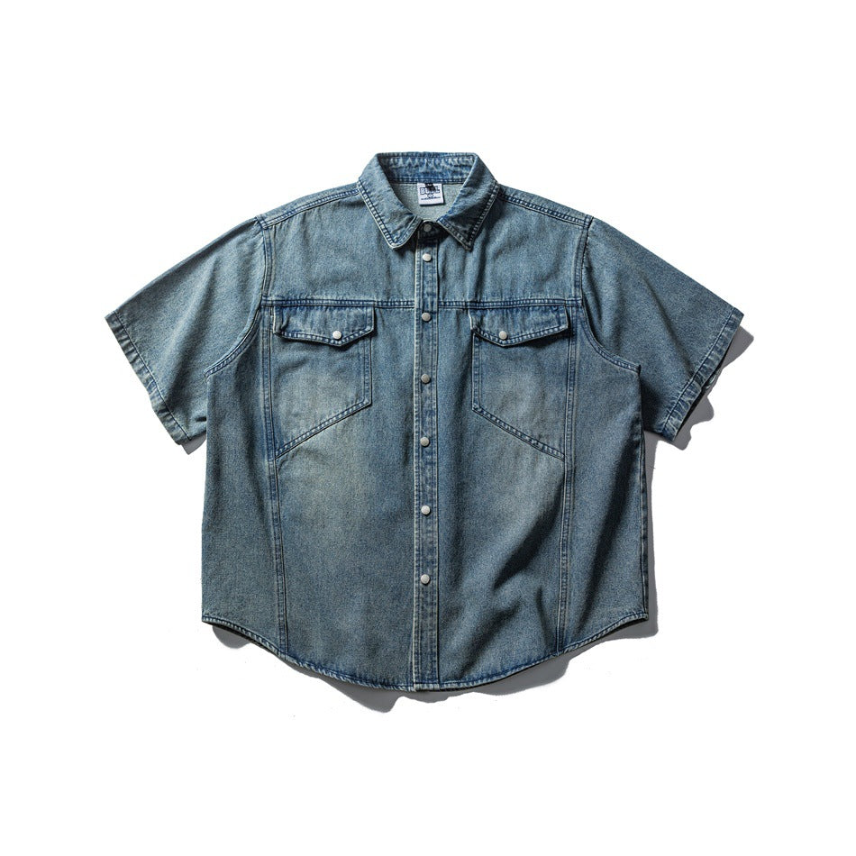Faded blue short-sleeve denim shirt, flat lay front view with chest flap pockets and snap front