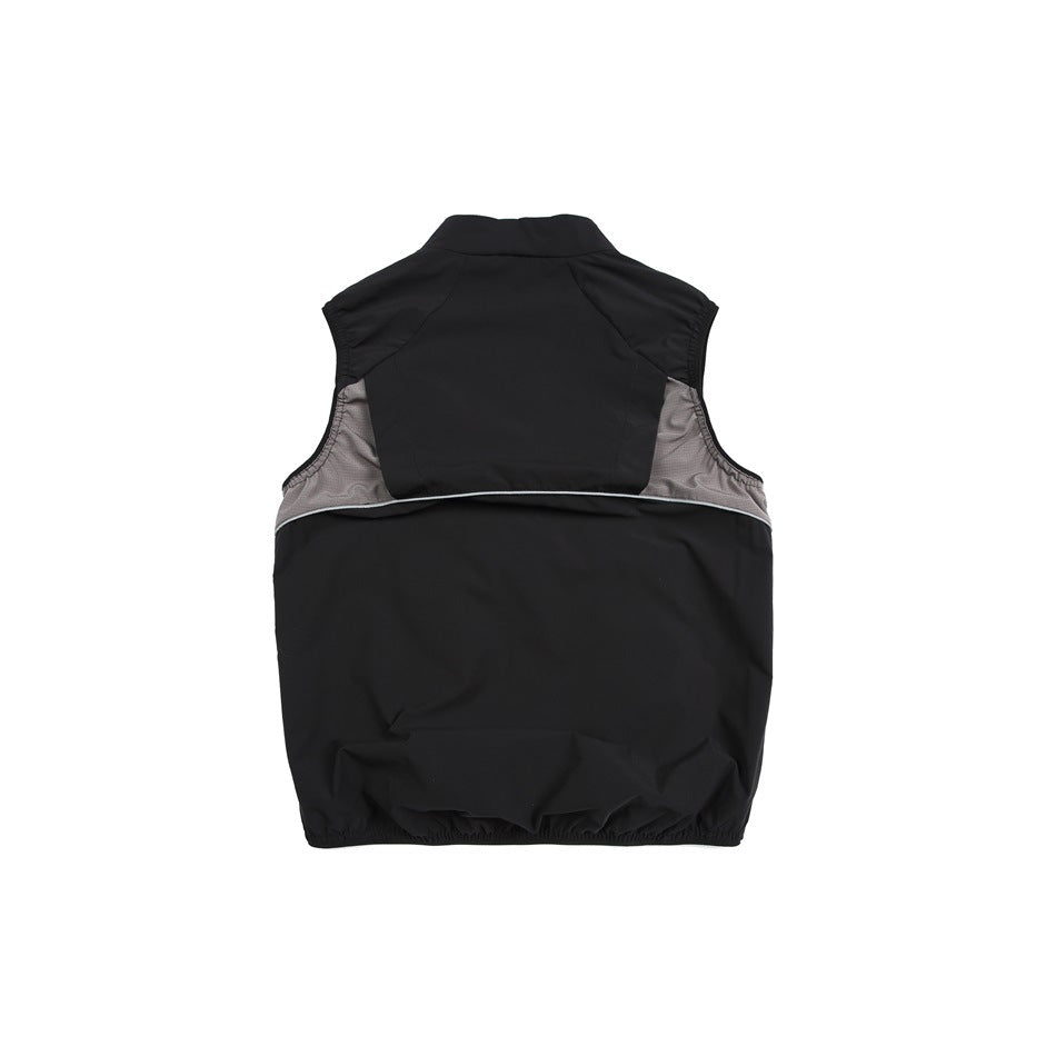 Back view of a black sleeveless vest with gray side panels and an elasticized hem.