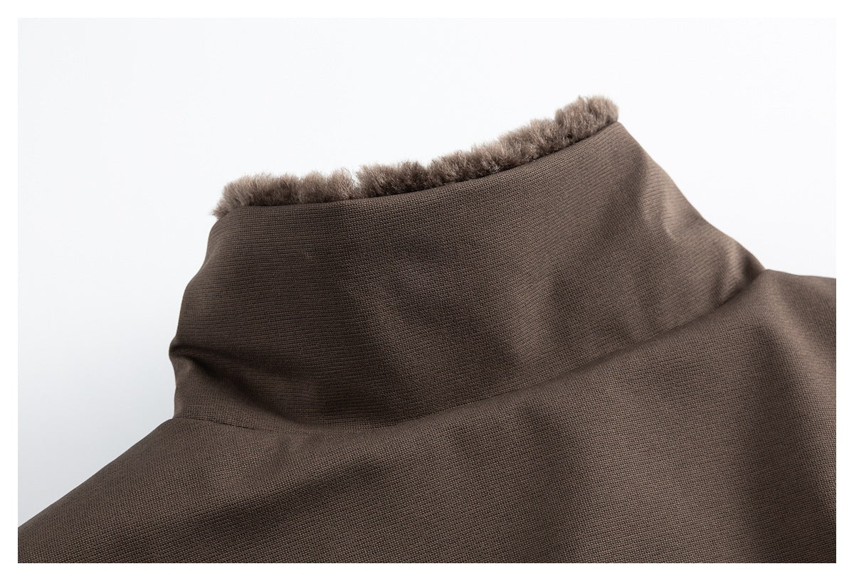 Close-up of a brown stand collar with plush brown trim along its edge.