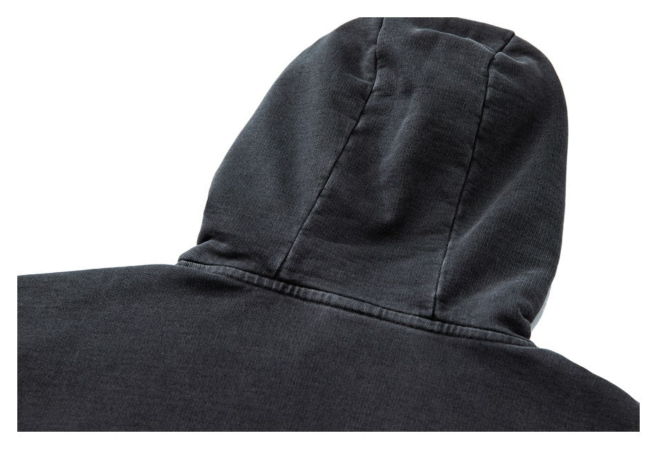 Close-up rear view of a black hoodie showing its hood seams and upper back.