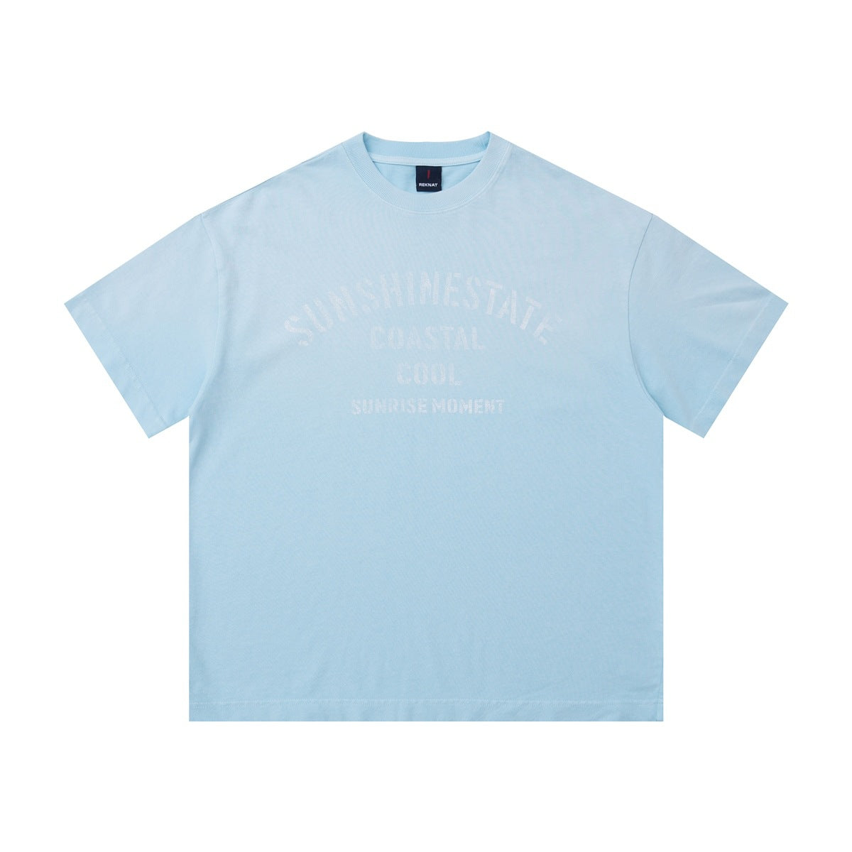 Light blue short-sleeve crew-neck T-shirt with faded white arched SUNSHINESTATE COASTAL COOL chest graphic, flat front view