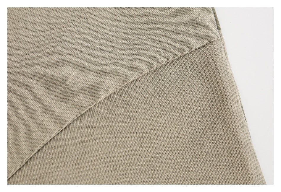 Close-up of tan fabric panels meeting along a diagonal seam.