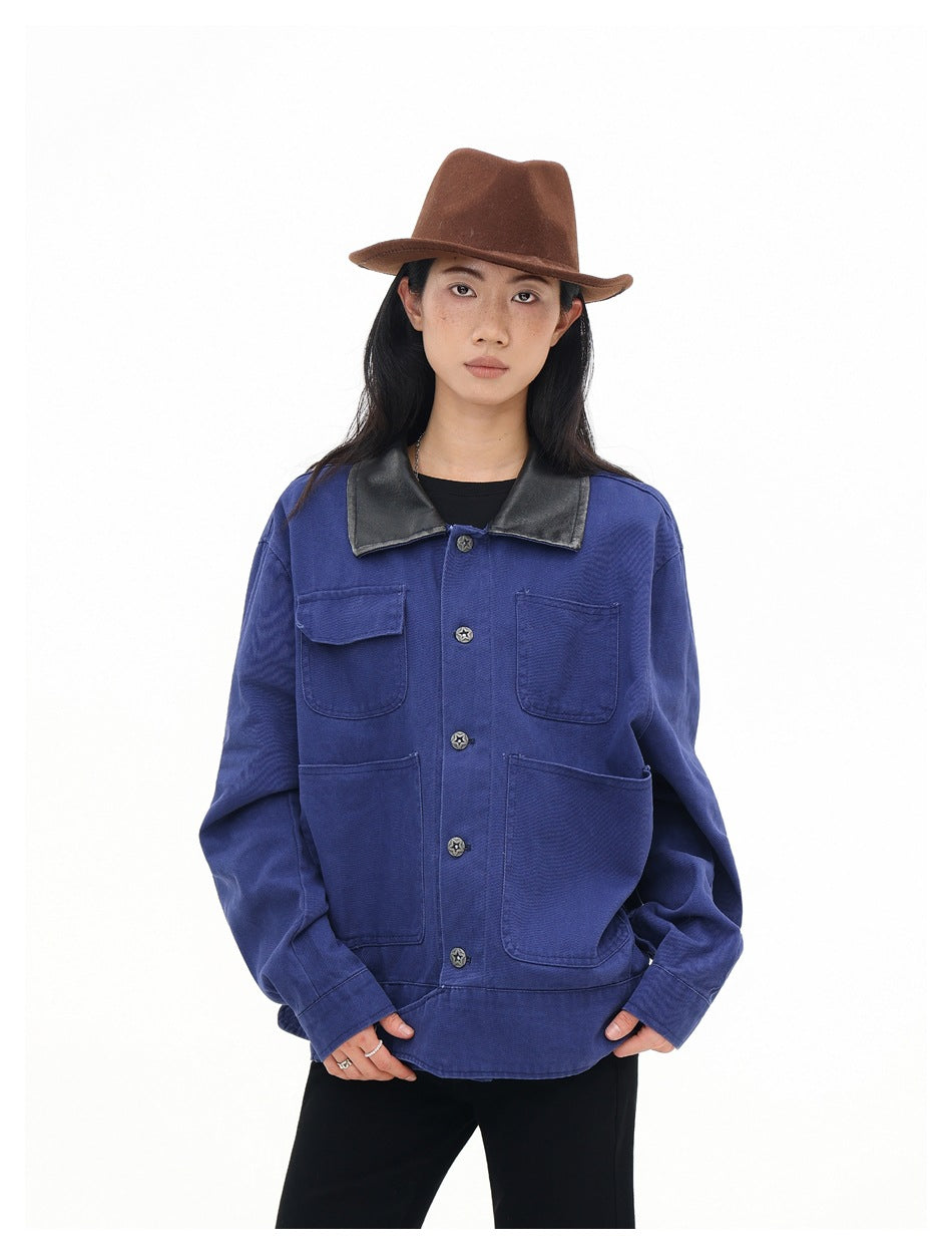 Model in a cobalt-blue jacket with a black collar, star-shaped buttons and four pockets, shown from the front.