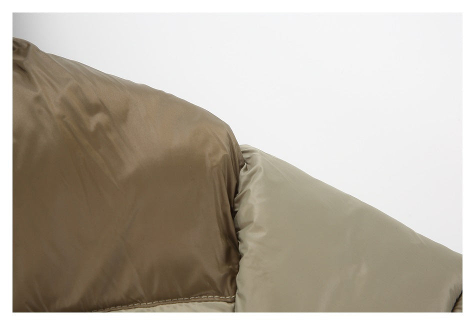 Close-up of the taupe puffer jacket’s contrasting brown and light-taupe quilted sleeve panels.