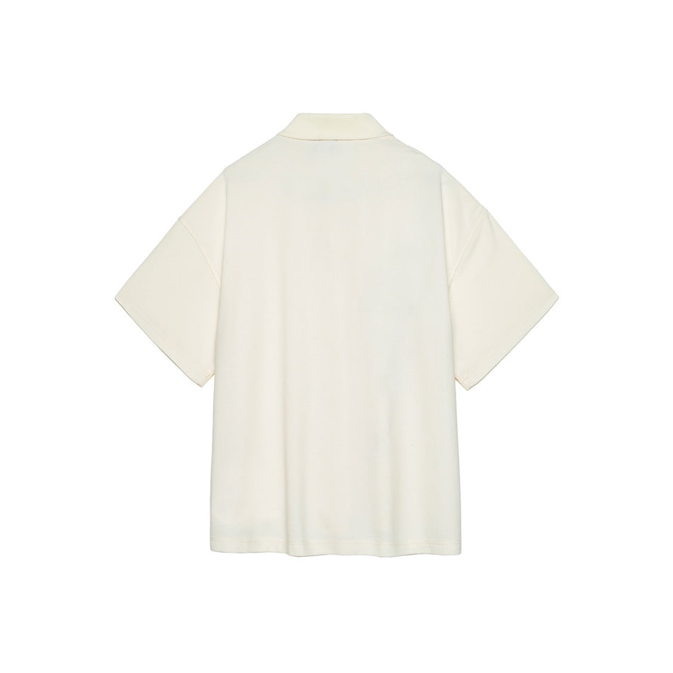 Back view of a plain cream short-sleeve polo top with a folded collar and dropped shoulders
