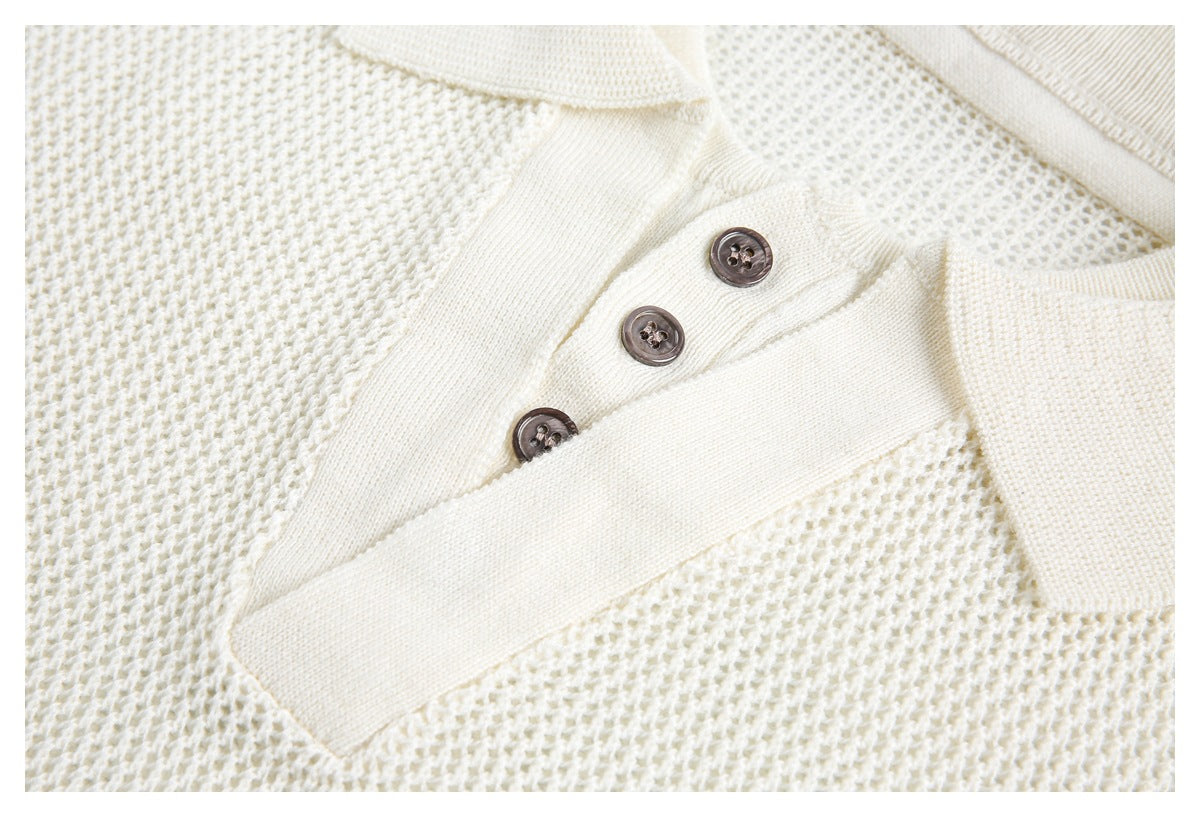 Close-up of an ivory knit polo top's textured fabric and three-button placket.