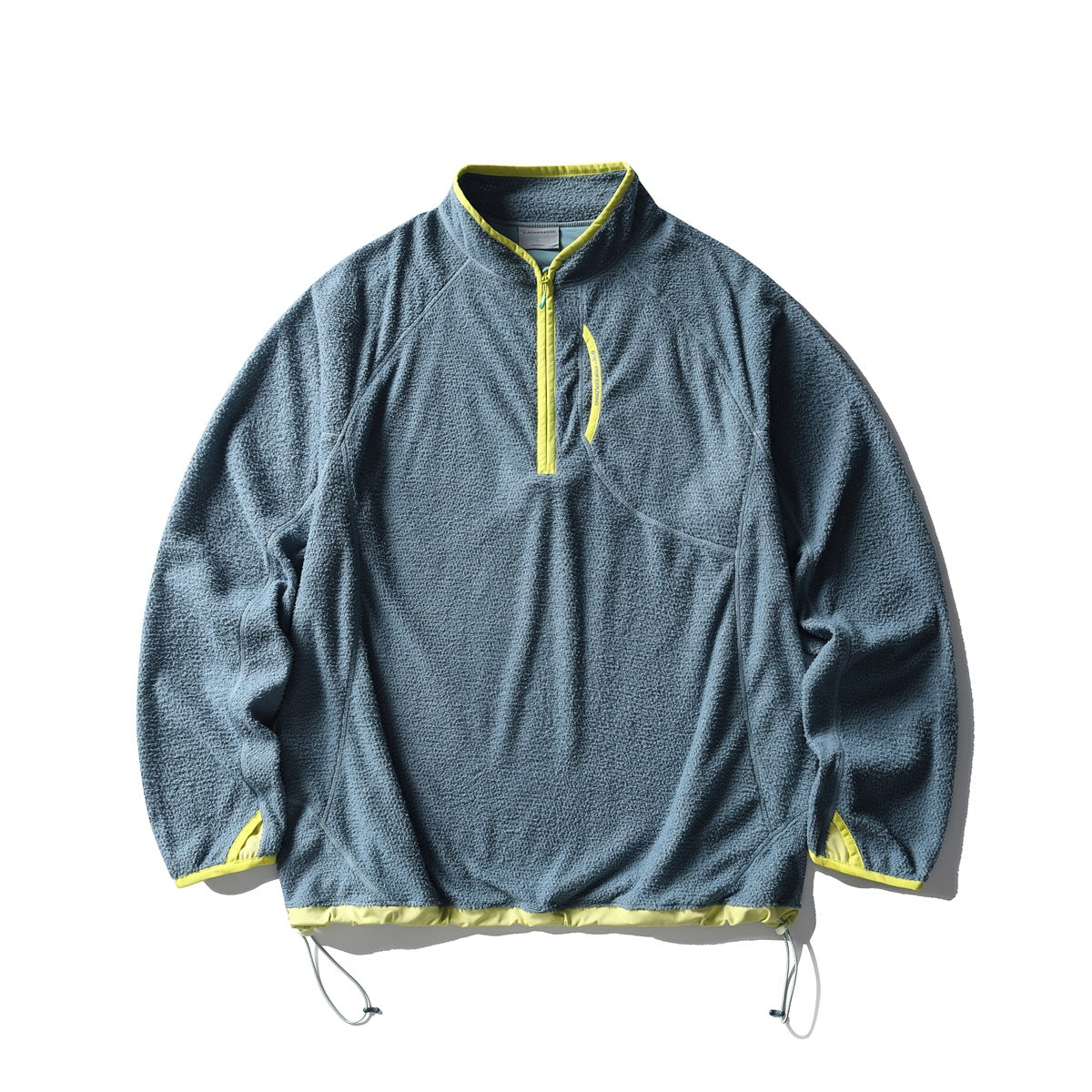 Blue-gray textured fleece-like half-zip pullover with lime yellow trim and drawstring hem, flat lay front view