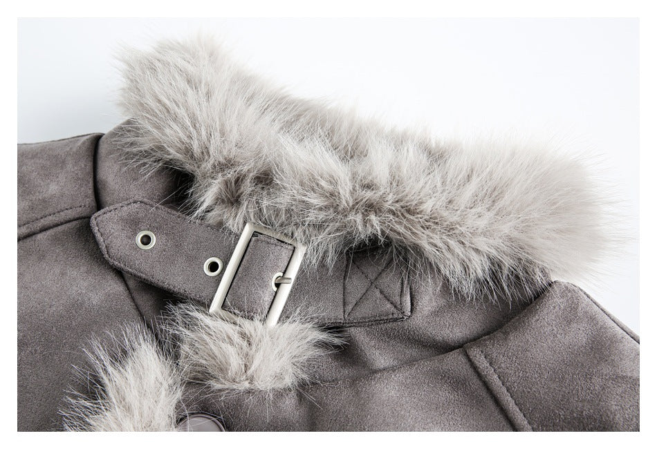 Close-up of a gray coat collar with pale faux-fur trim and a silver buckle strap.
