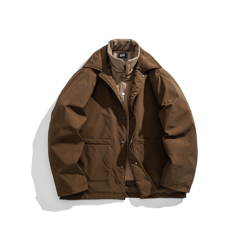 Brown jacket with snaps unfastened, showing the plaid inner layer and patch pockets, flat lay