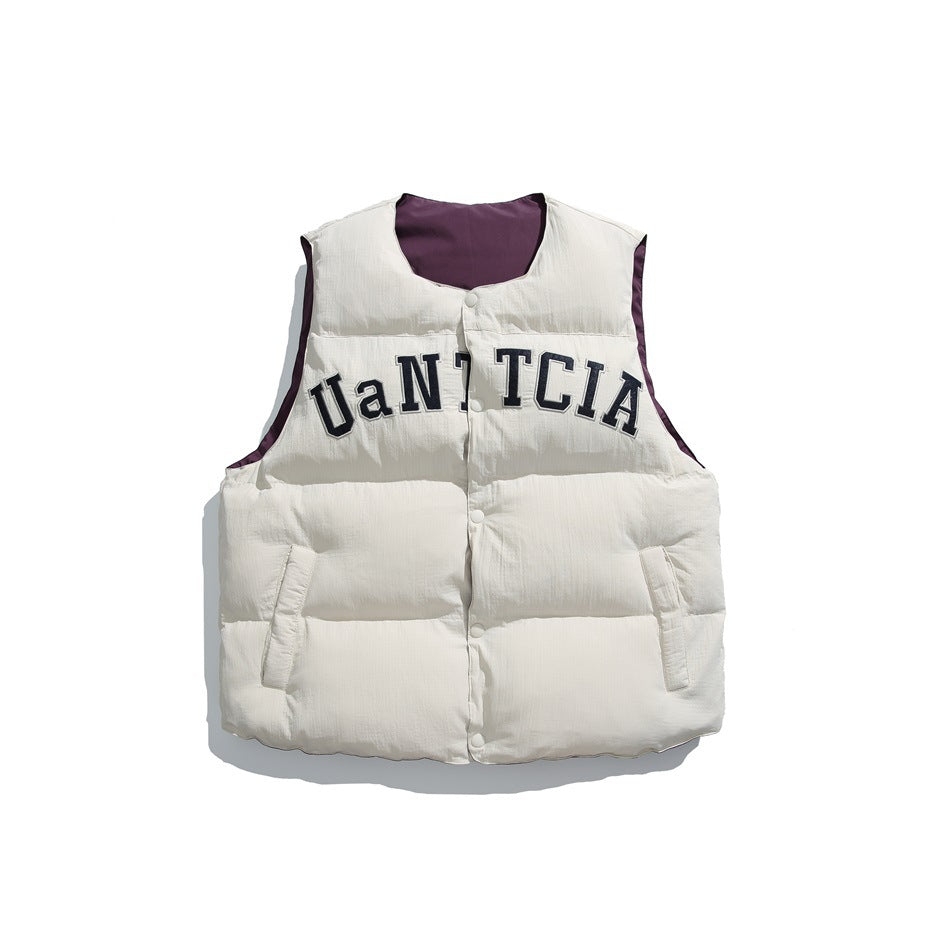 Off-white puffer vest with snap front, front pockets and navy arched letter patch, purple inner side visible at neckline