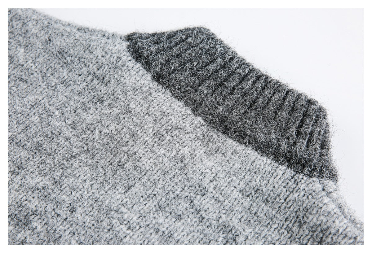 Close-up of light gray knit fabric beside a dark gray ribbed section.